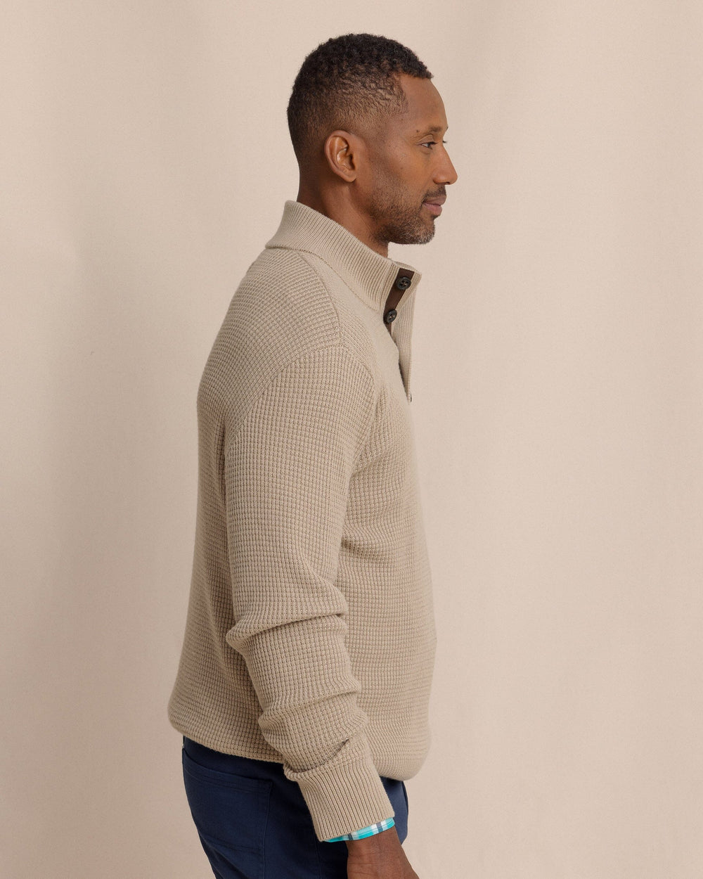 The side view of the Southern Tide Bass Creek Heather Quarter Button Sweater by Southern Tide - Heather Sandstone Khaki