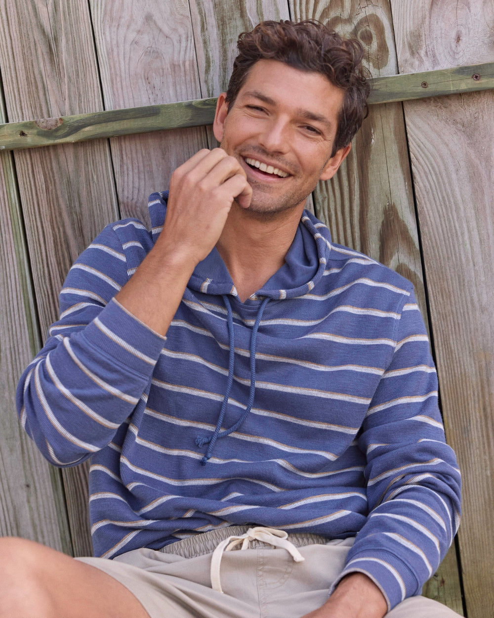 The lifestyle view of the Southern Tide Bay View Stripe Hoodie by Southern Tide - Light Indigo