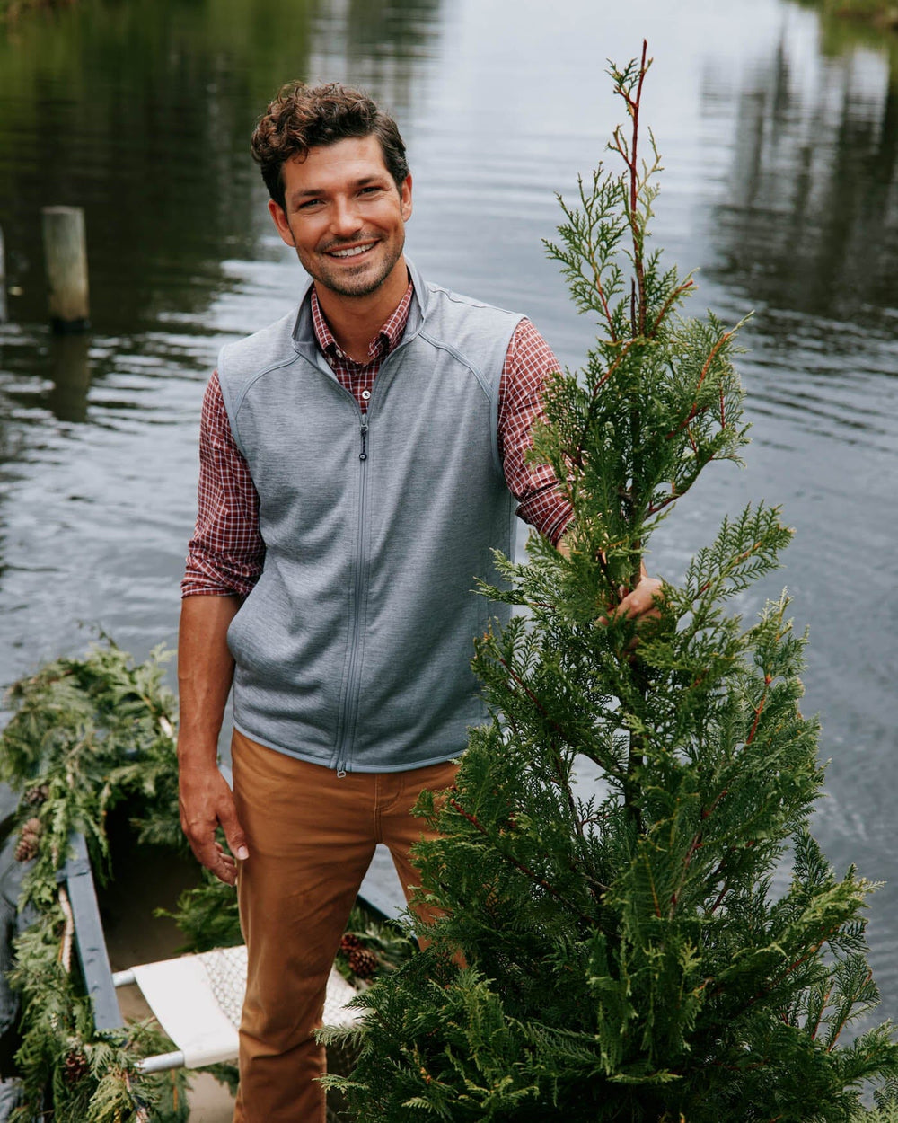 The lifestyle view of the Southern Tide Baybrook Heather Vest by Southern Tide - Heather Ultimate Grey