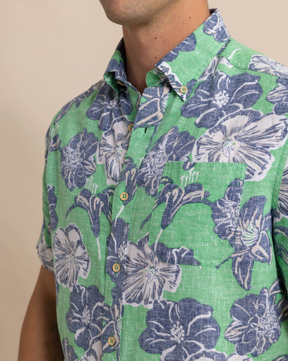 The detail view of the Southern Tide Beach Blooms Linen Rayon Short Sleeve Sport Shirt by Southern Tide - Lawn Green