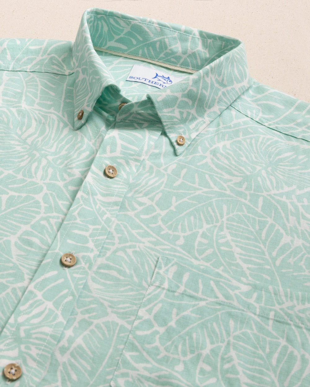 The detail view of the Southern Tide Beach Palms Linen Rayon Short Sleeve Sport Shirt by Southern Tide - Garden Grove