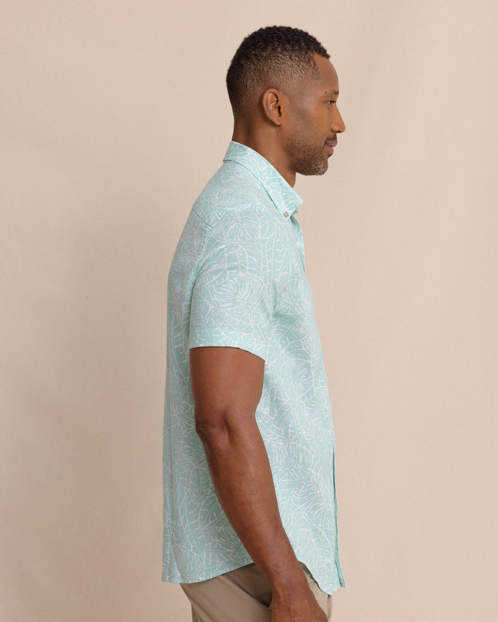 The side view of the Southern Tide Beach Palms Linen Rayon Short Sleeve Sport Shirt by Southern Tide - Garden Grove