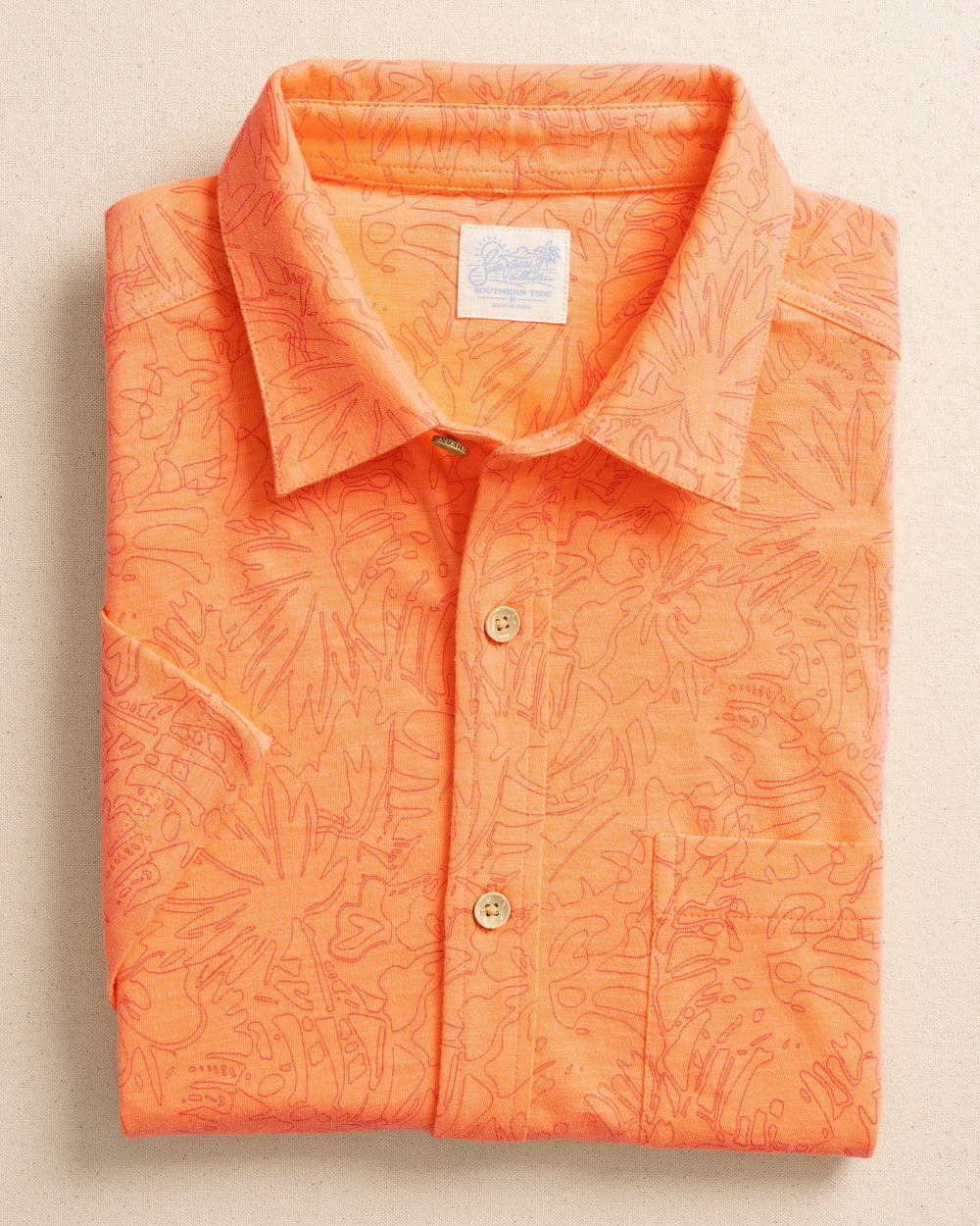 The front view of the Southern Tide Beachcast Floral Fusion Knit Short Sleeve Sport Shirt by Southern Tide - Cantaloupe