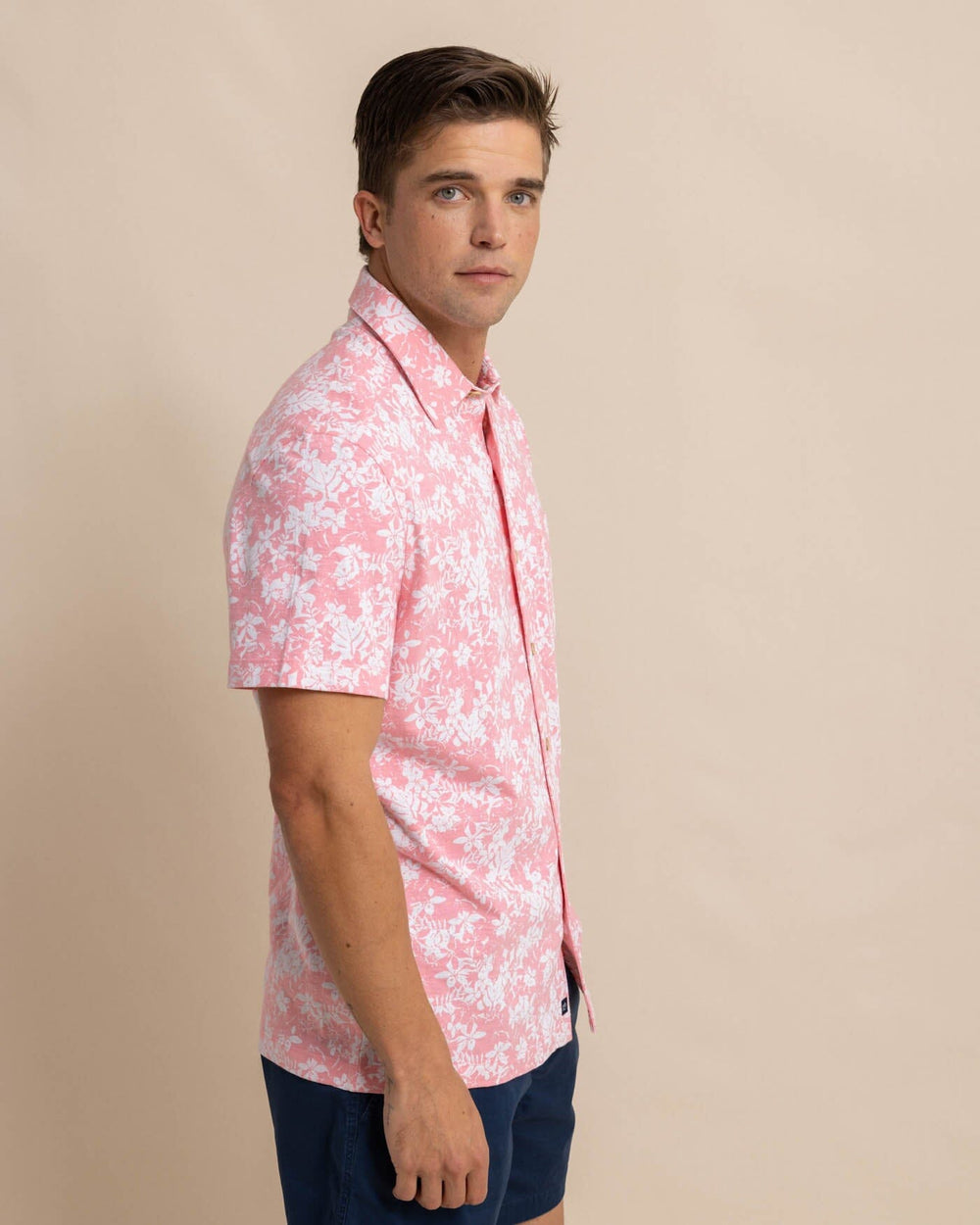 The front view of the Southern Tide Beachcast Island Blooms Knit Short Sleeve Sport Shirt by Southern Tide - Geranium Pink