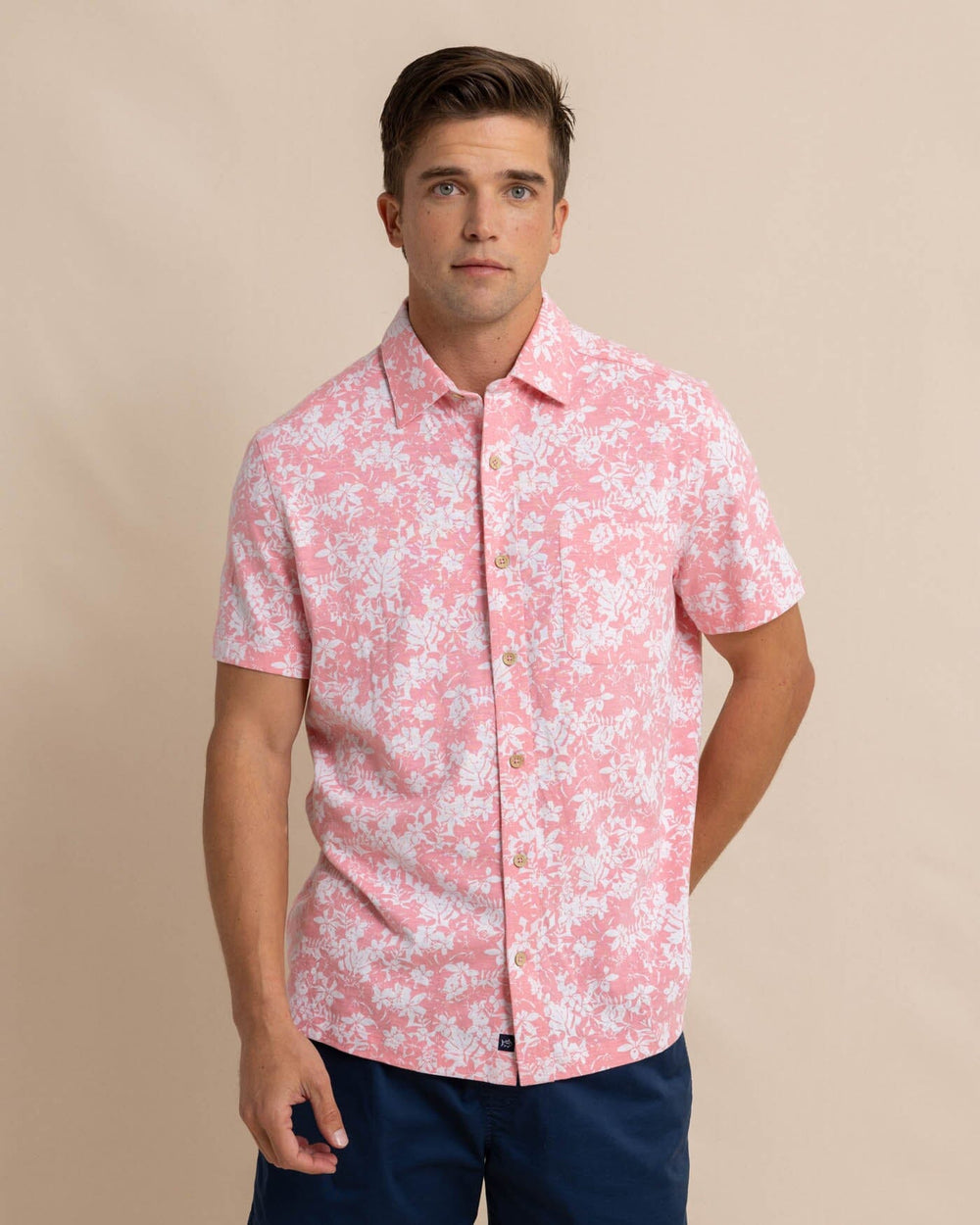 The front view of the Southern Tide Beachcast Island Blooms Knit Short Sleeve Sport Shirt by Southern Tide - Geranium Pink