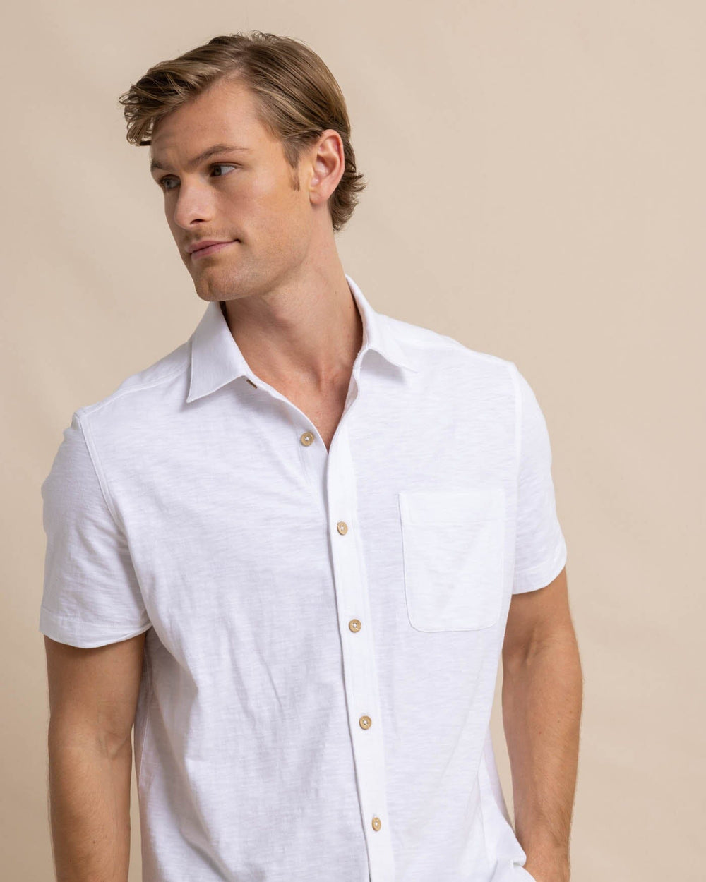 The front view of the Southern Tide Beachcast Solid Knit Short Sleeve Sport Shirt by Southern Tide - Classic White