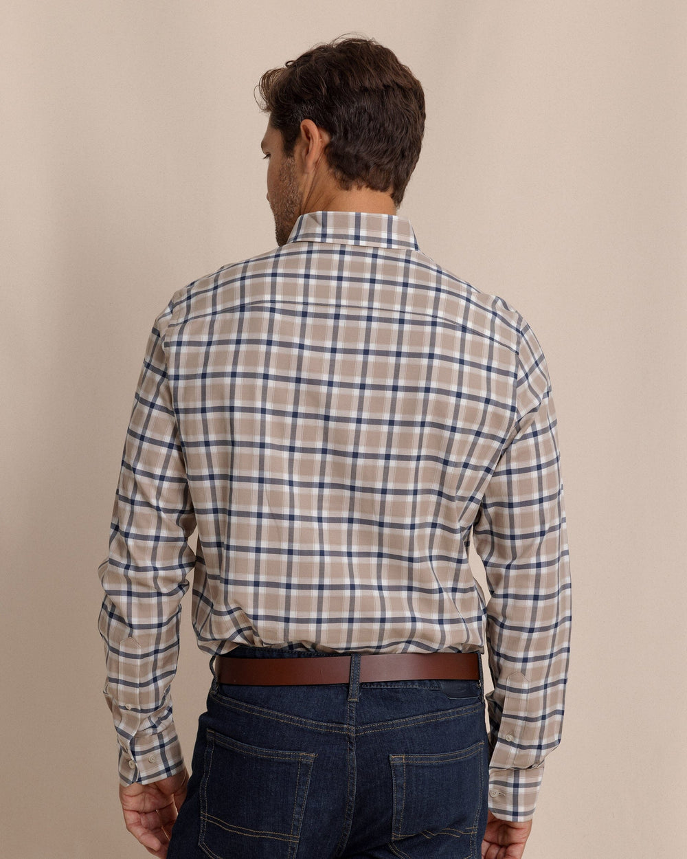 The back view of the Southern Tide Beachrock Plaid Skipjack Long Sleeve Sport Shirt by Southern Tide - Sandstone Khaki