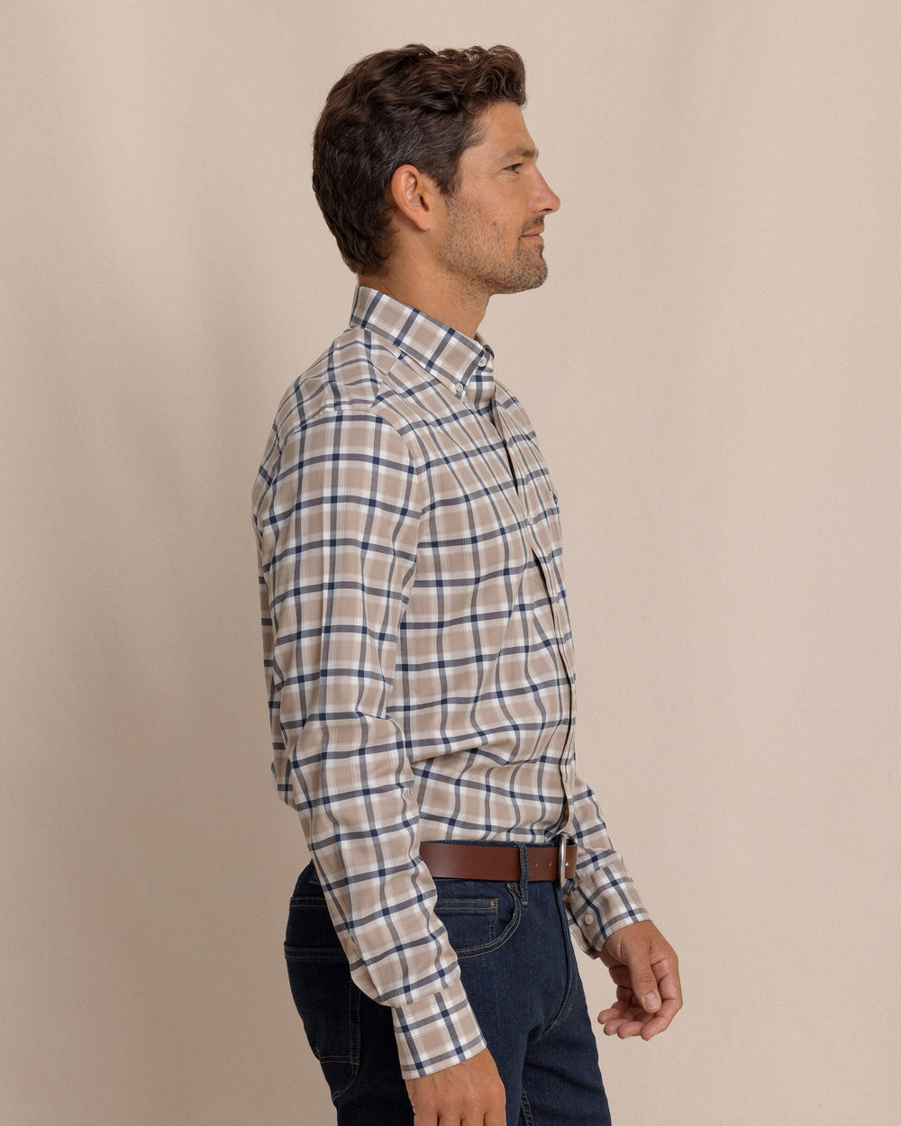 The side view of the Southern Tide Beachrock Plaid Skipjack Long Sleeve Sport Shirt by Southern Tide - Sandstone Khaki