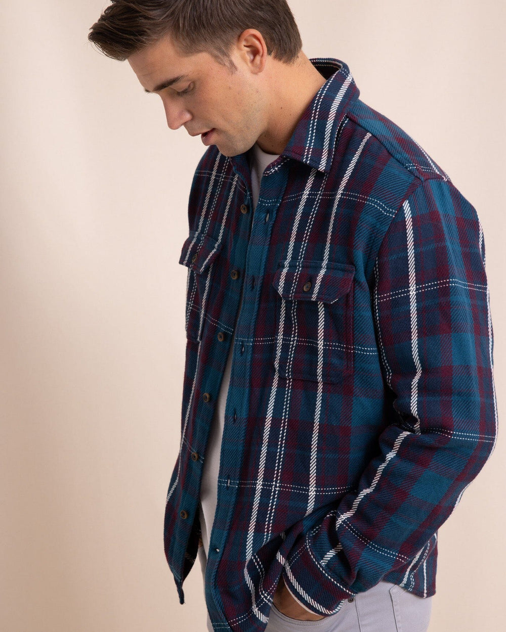 The side view of the Southern Tide Beachwood Plaid Twill Long Sleeve Shirt by Southern Tide - Dress Blue