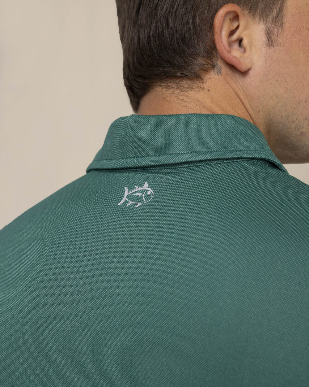 The detail view of the Southern Tide Belfair Performance Long Sleeve Polo by Southern Tide - Fir