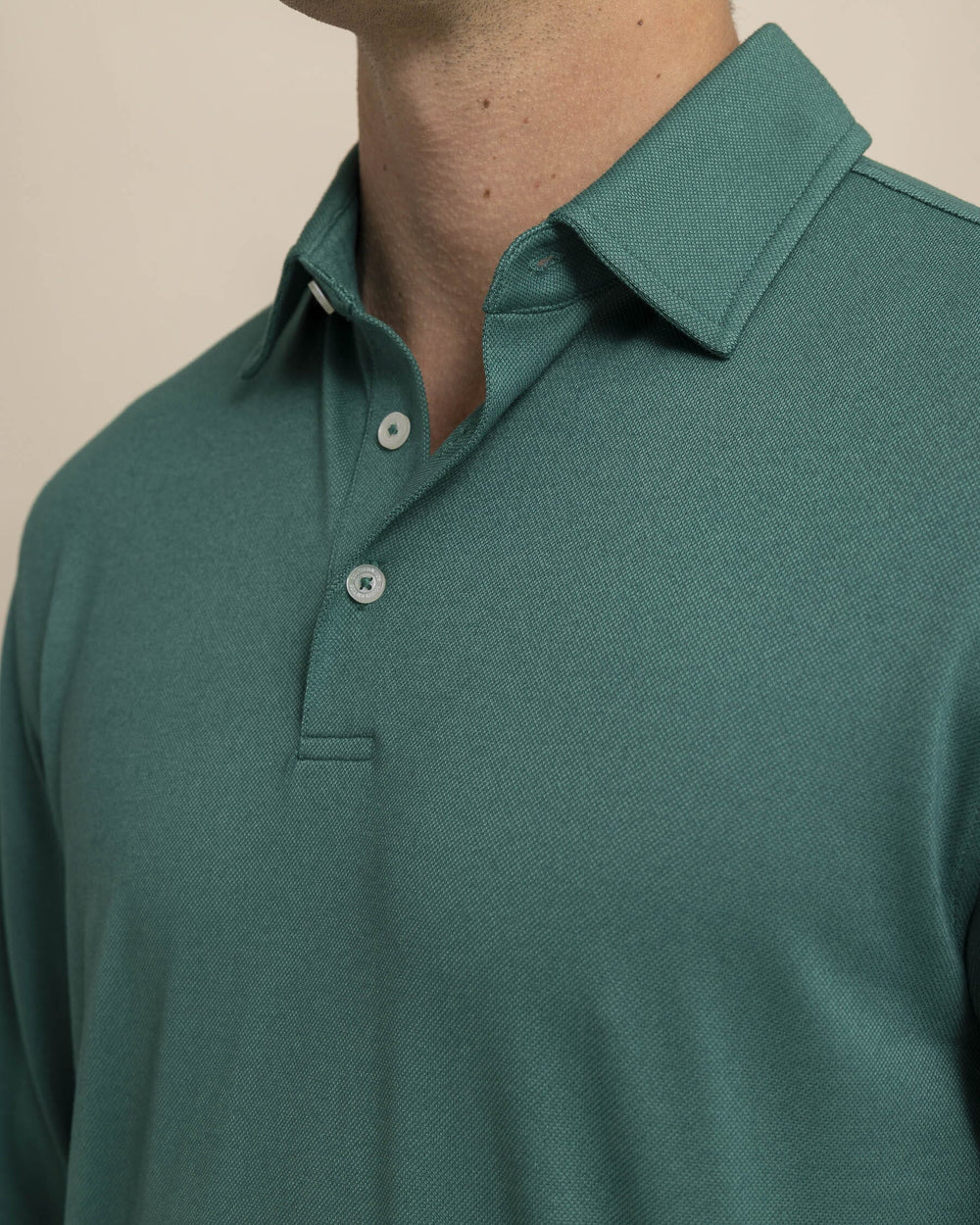 The detail view of the Southern Tide Belfair Performance Long Sleeve Polo by Southern Tide - Fir