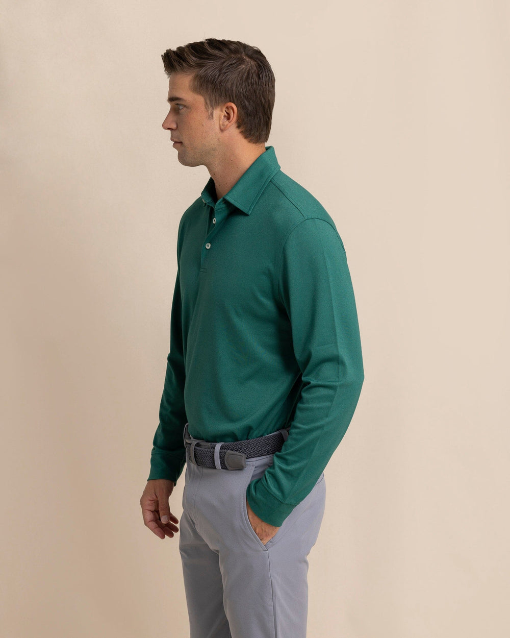 The side view of the Southern Tide Belfair Performance Long Sleeve Polo by Southern Tide - Fir