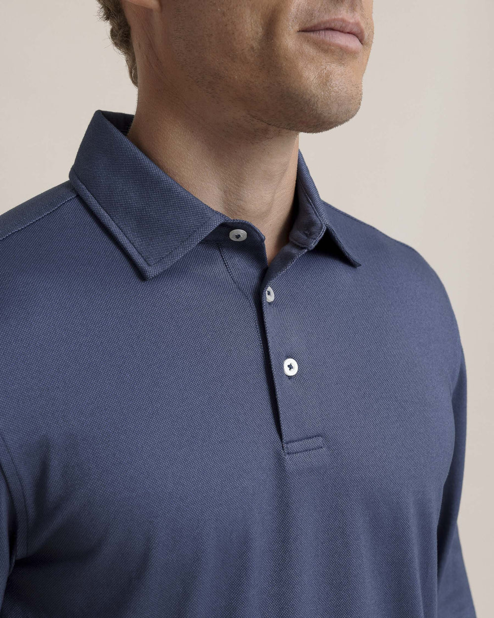 The detail view of the Southern Tide Belfair Performance Long Sleeve Polo by Southern Tide - Light Indigo