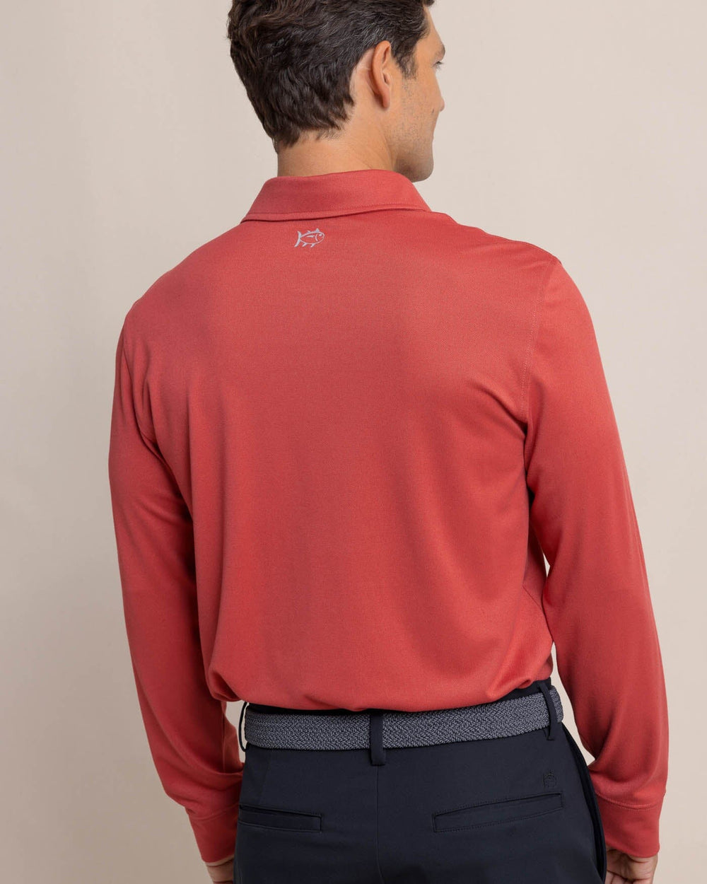 The back view of the Southern Tide Belfair Performance Long Sleeve Polo by Southern Tide - Mineral Red