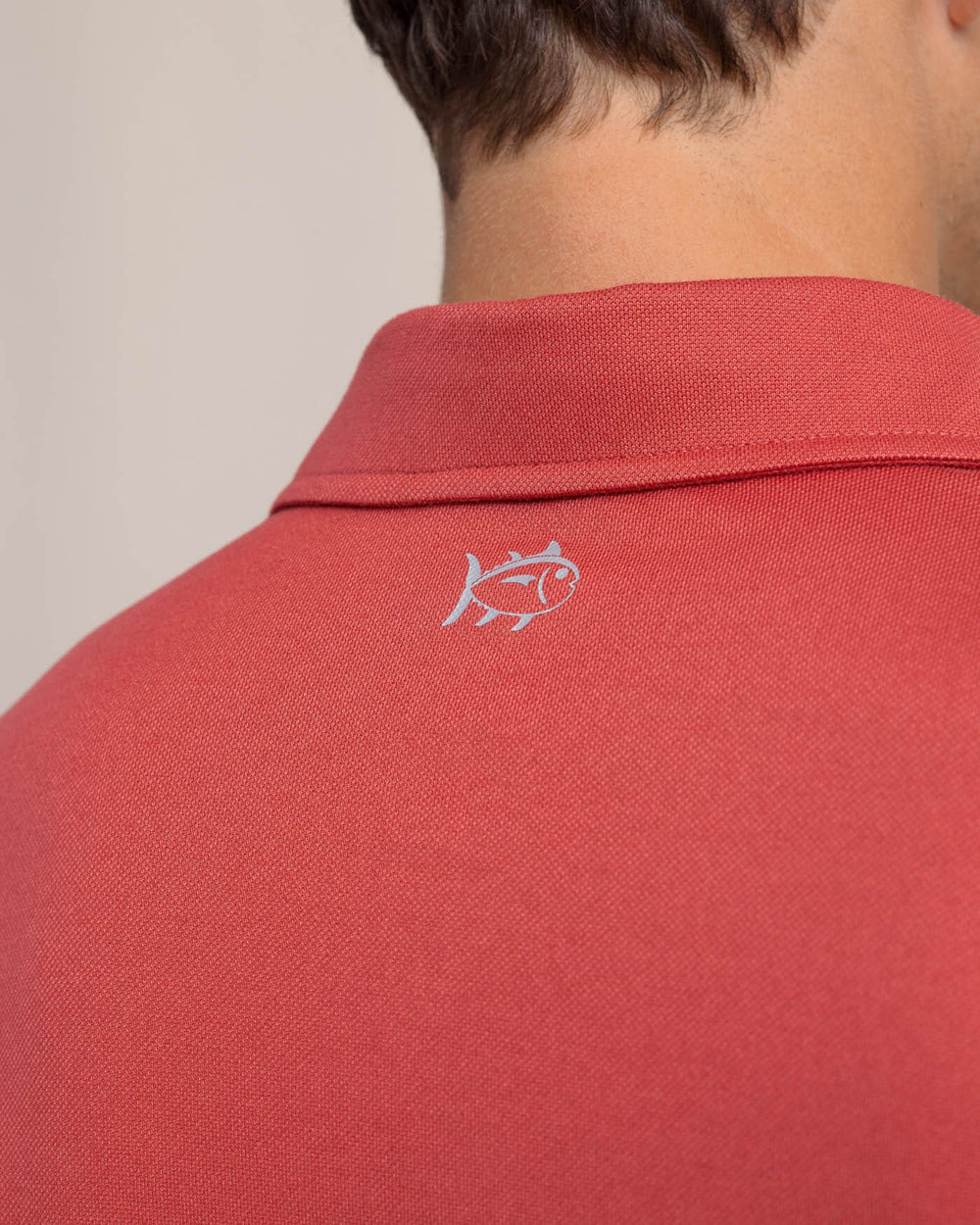 The detail view of the Southern Tide Belfair Performance Long Sleeve Polo by Southern Tide - Mineral Red