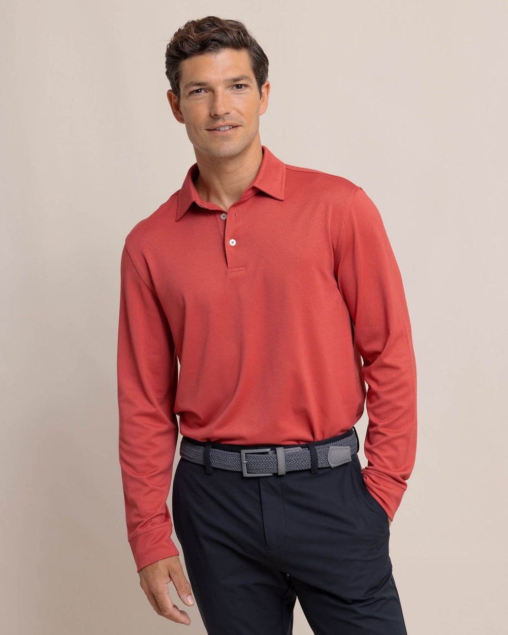 The front view of the Southern Tide Belfair Performance Long Sleeve Polo by Southern Tide - Mineral Red