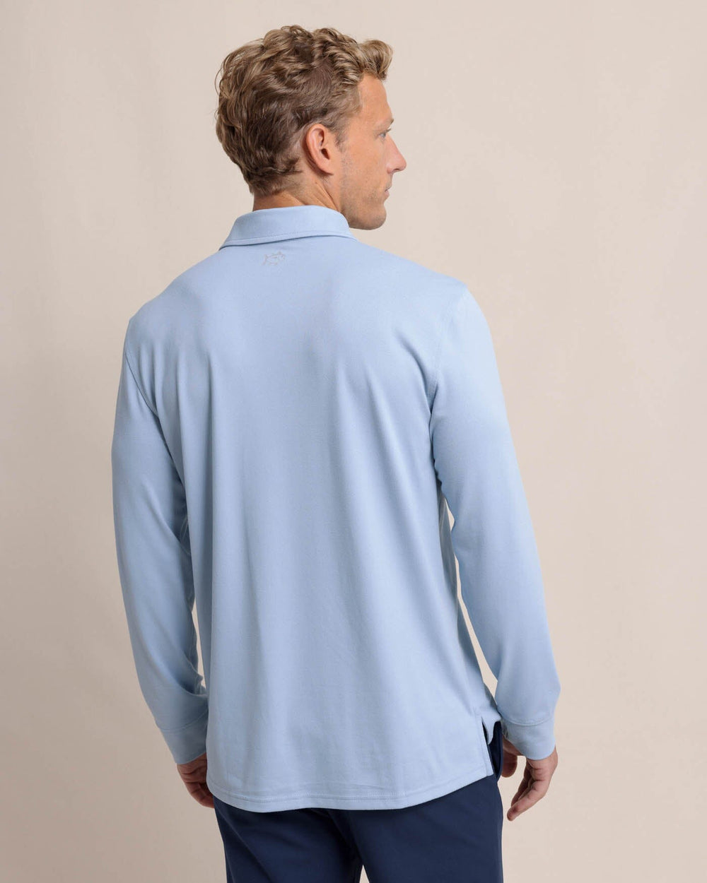 The back view of the Southern Tide Belfair Performance Long Sleeve Polo by Southern Tide - Triumph Blue