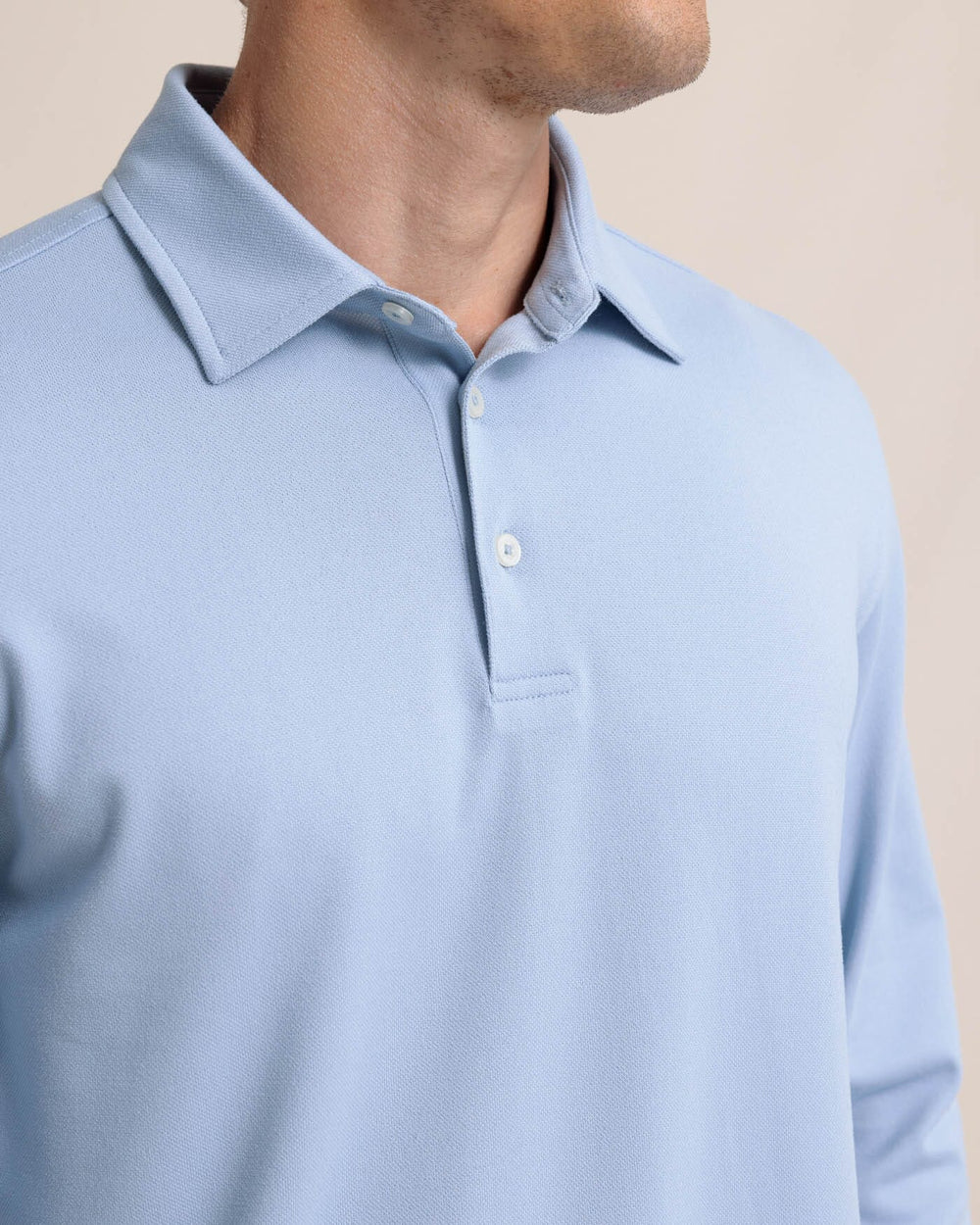 The detail view of the Southern Tide Belfair Performance Long Sleeve Polo by Southern Tide - Triumph Blue