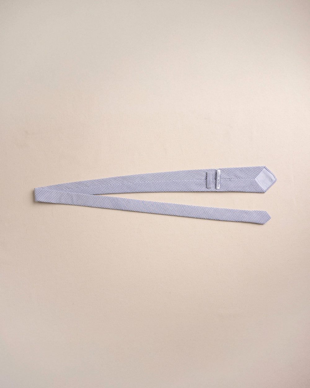 The untied view of the Southern Tide Blue and White Seersucker Necktie by Southern Tide - Blue