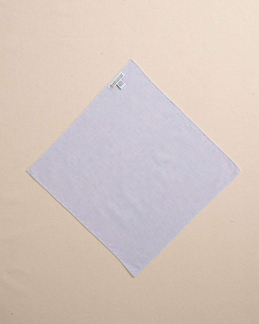 The back view of the High Cotton Blue Chambray Pocket Square at Southern Tide - Blue