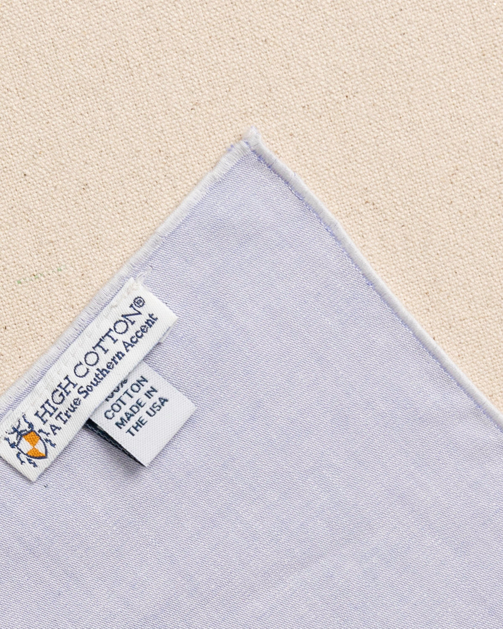 The back detail view of the High Cotton Blue Chambray Pocket Square at Southern Tide - Blue