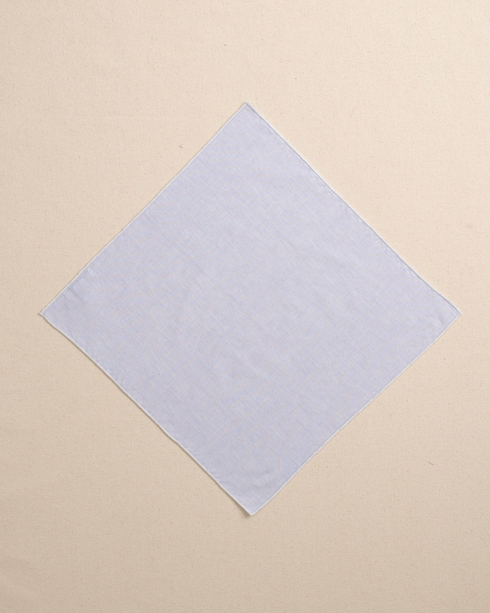 The front view of the High Cotton Blue Chambray Pocket Square at Southern Tide - Blue