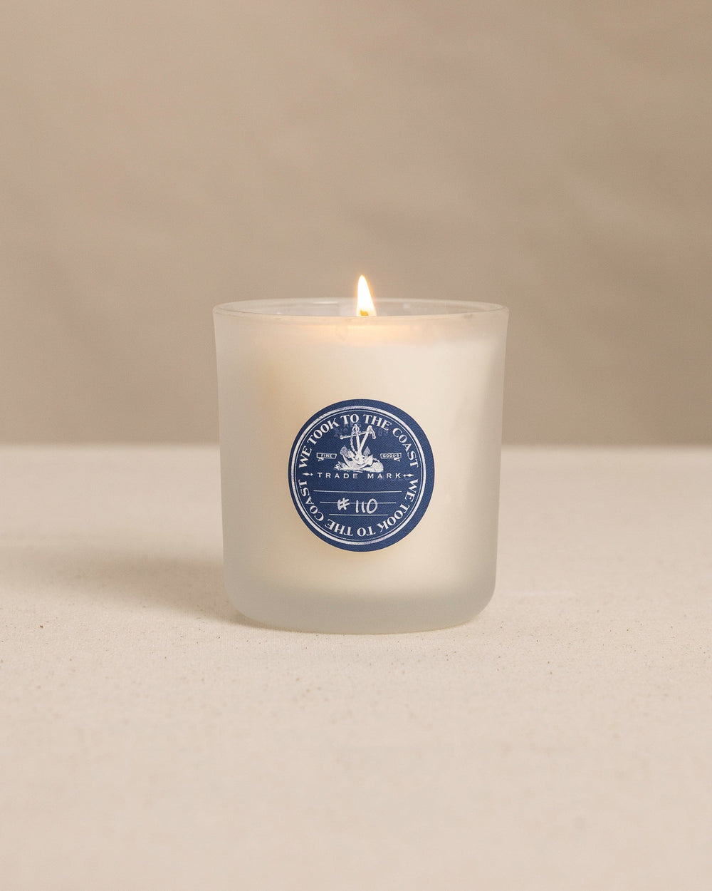 The front view of the We Took to the Woods Blue Jeans, White Shirt Candle at Southern Tide - White