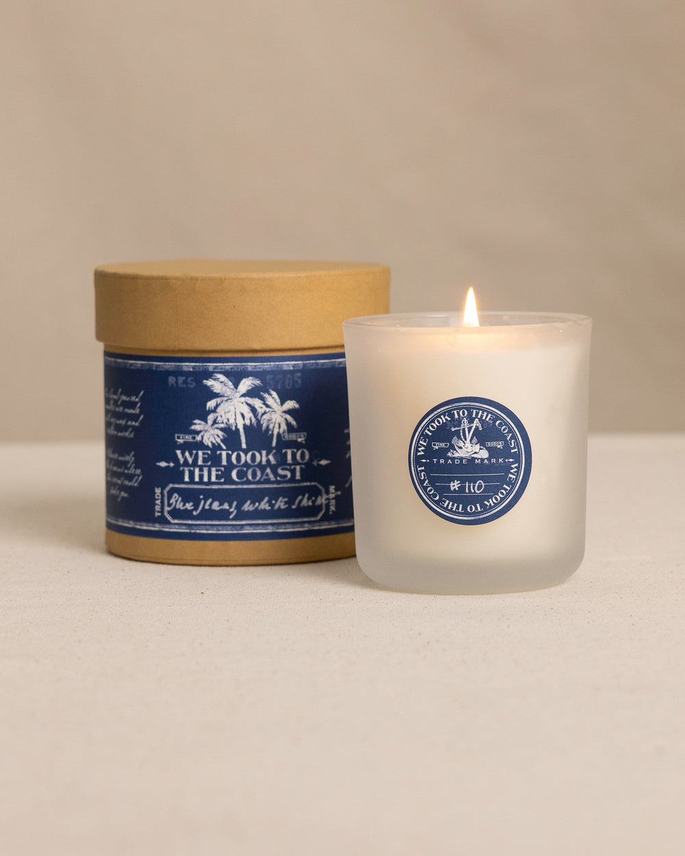 The front view of the We Took to the Woods Blue Jeans, White Shirt Candle at Southern Tide - White