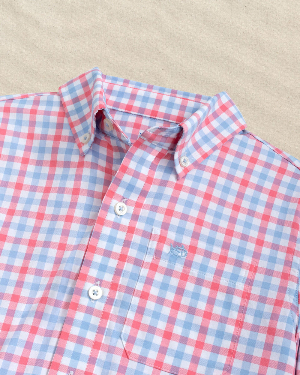 The detail view of the Southern Tide Boys Albemarle Plaid Intercoastal Sport Shirt by Southern Tide - Sunkist Coral