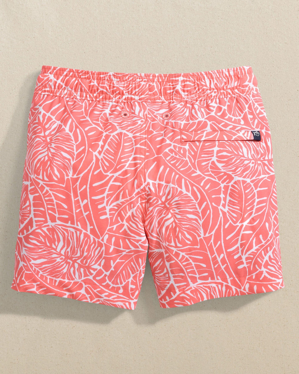 The back view of the Southern Tide Boys Beach Palms Swim Trunk by Southern Tide - Sunkist Coral