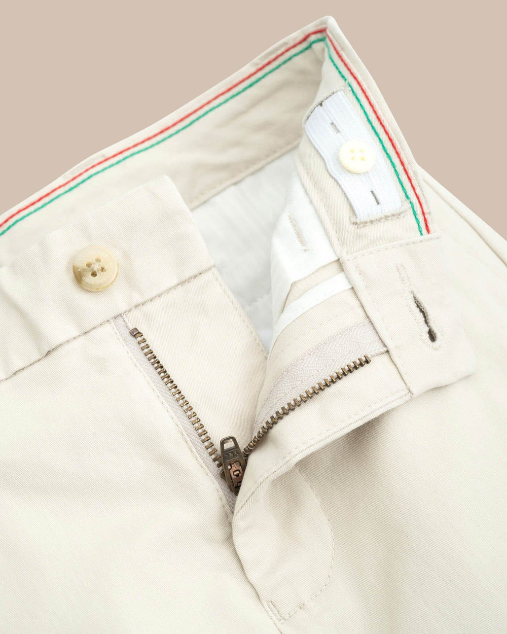 The detail view of the Boys Channel Marker Pant by Southern Tide - Light Khaki