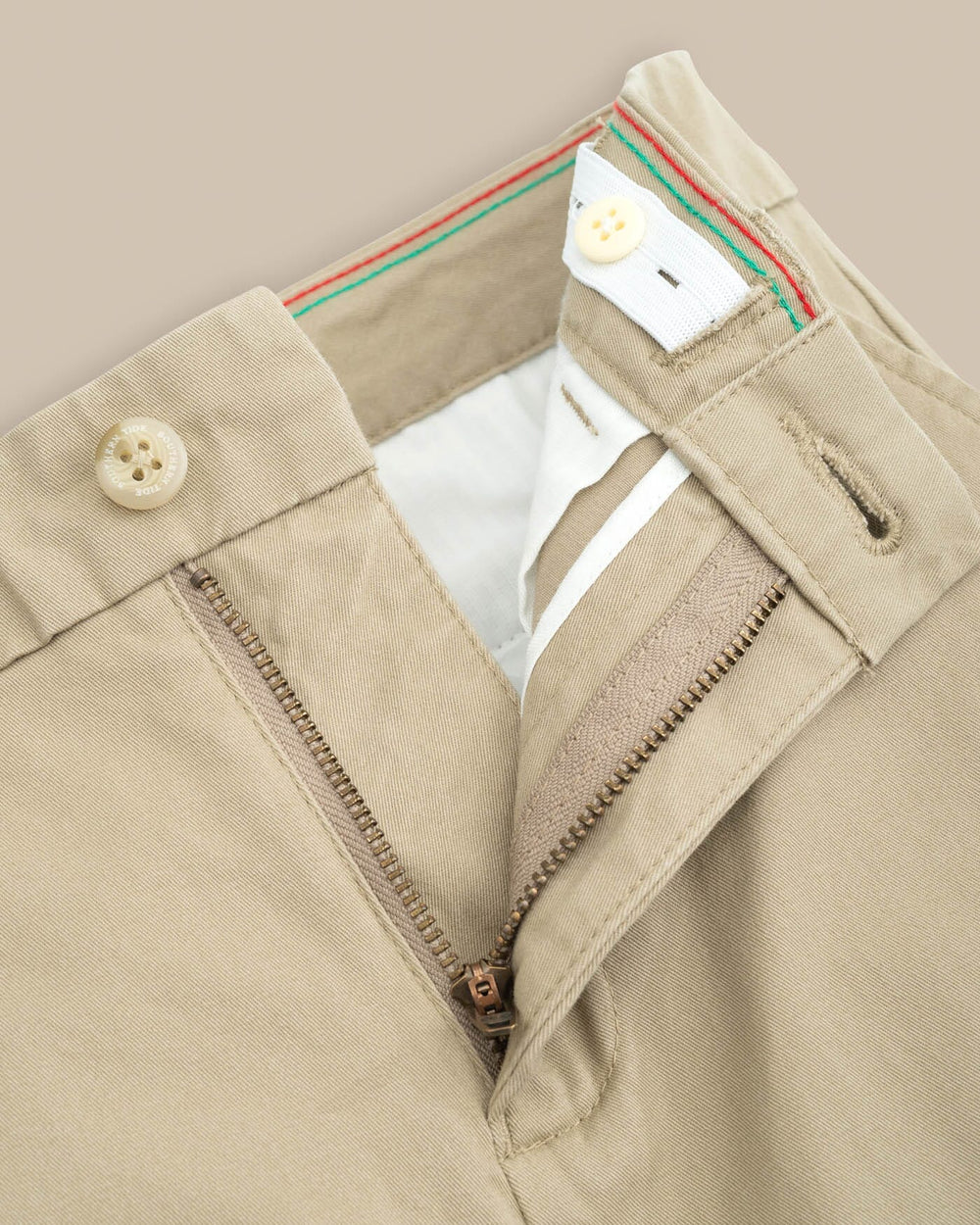 The detail view of the Boys Channel Marker Pant by Southern Tide - Sandstone Khaki