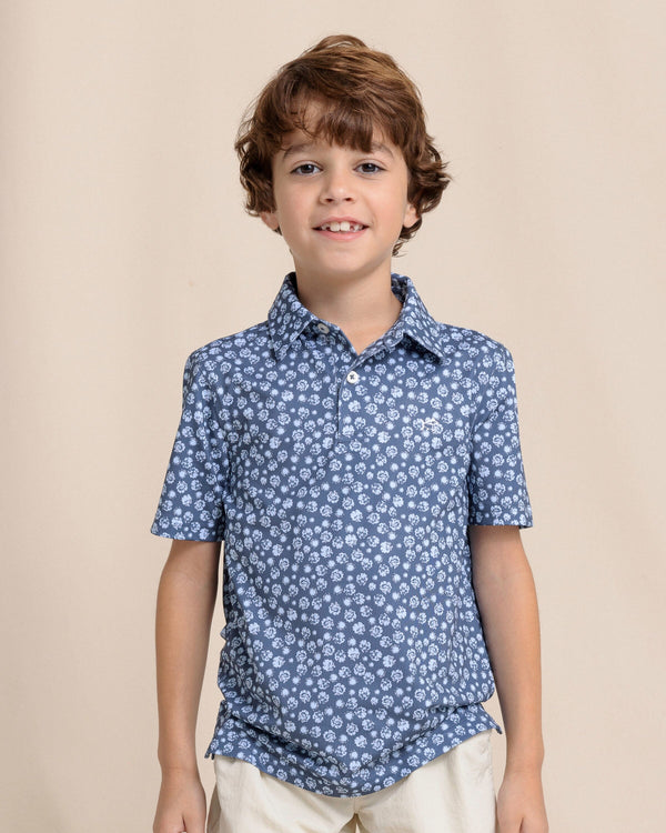 The front view of the Southern Tide Boys Driver Blossom Bliss Performance Polo by Southern Tide - Light Indigo
