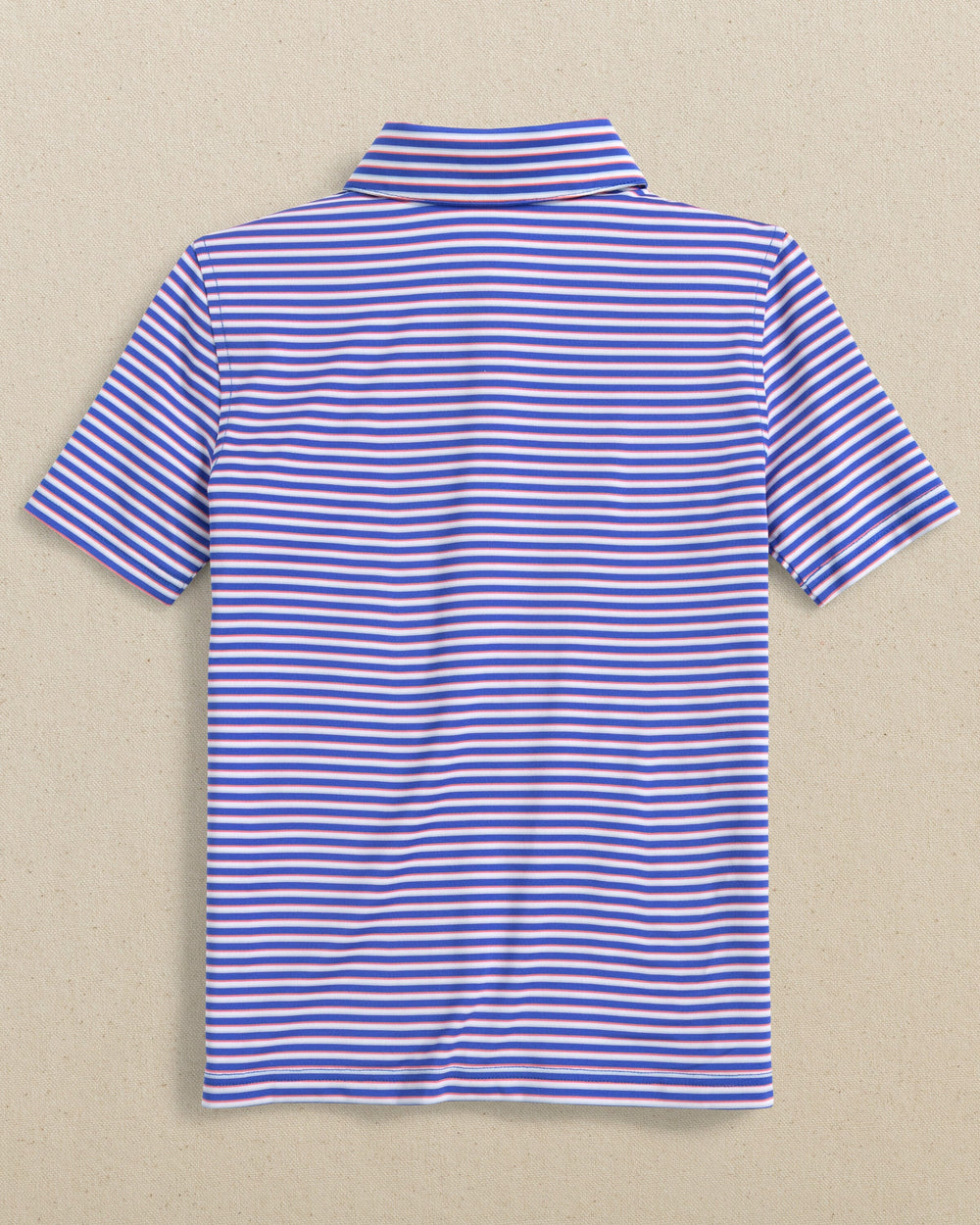 The back view of the Southern Tide Kids Driver Caravel Stripe Performance Polo by Southern Tide - Dazzling Blue