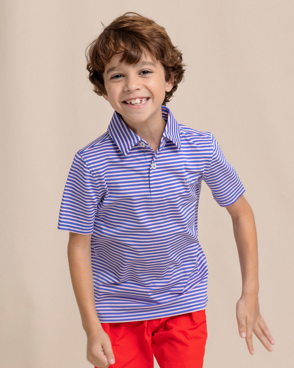 The front view of the Southern Tide Kids Driver Caravel Stripe Performance Polo by Southern Tide - Dazzling Blue