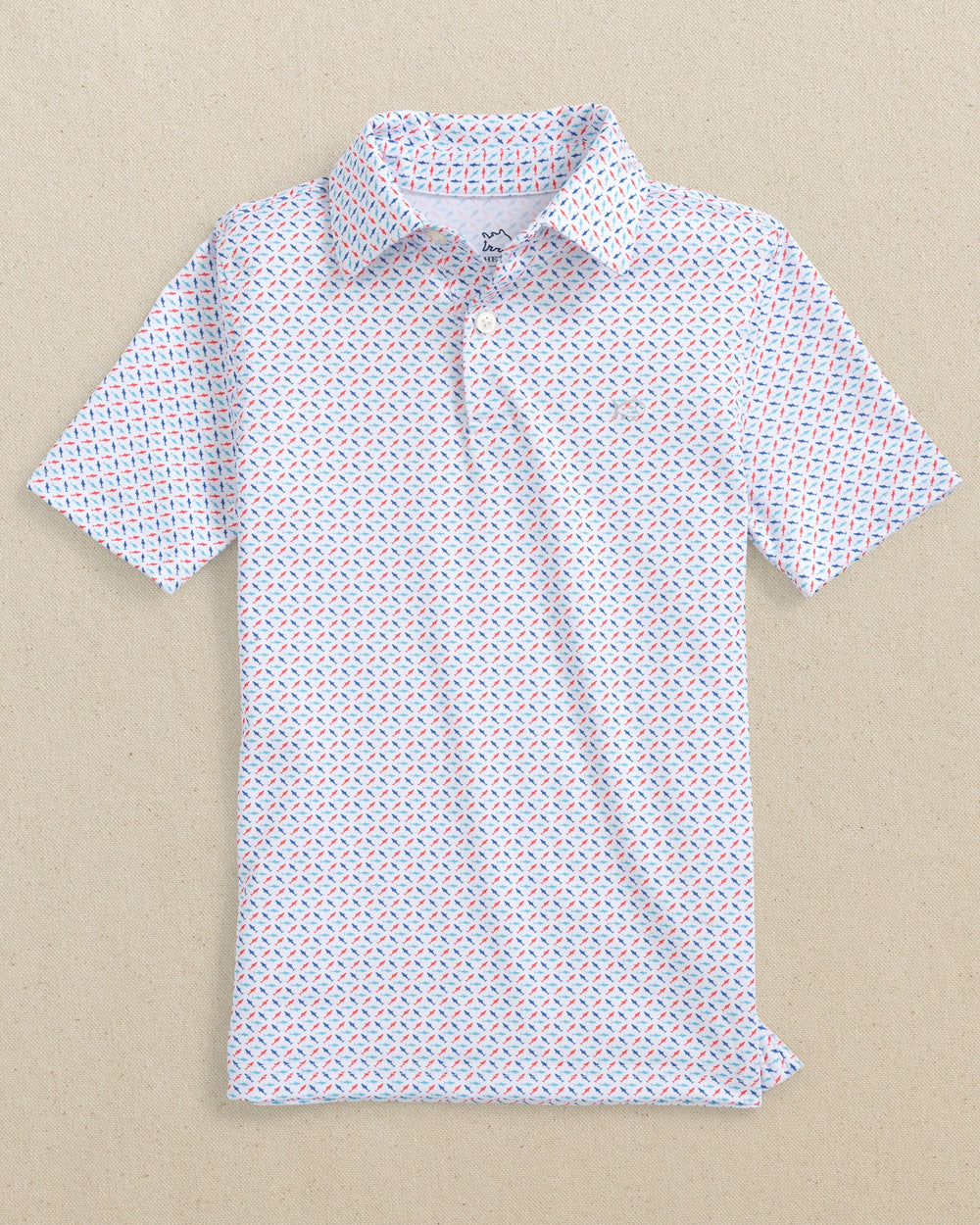 The front view of the Southern Tide Boys Driver Fin-tastic Catch Printed Performance Polo by Southern Tide - Classic White