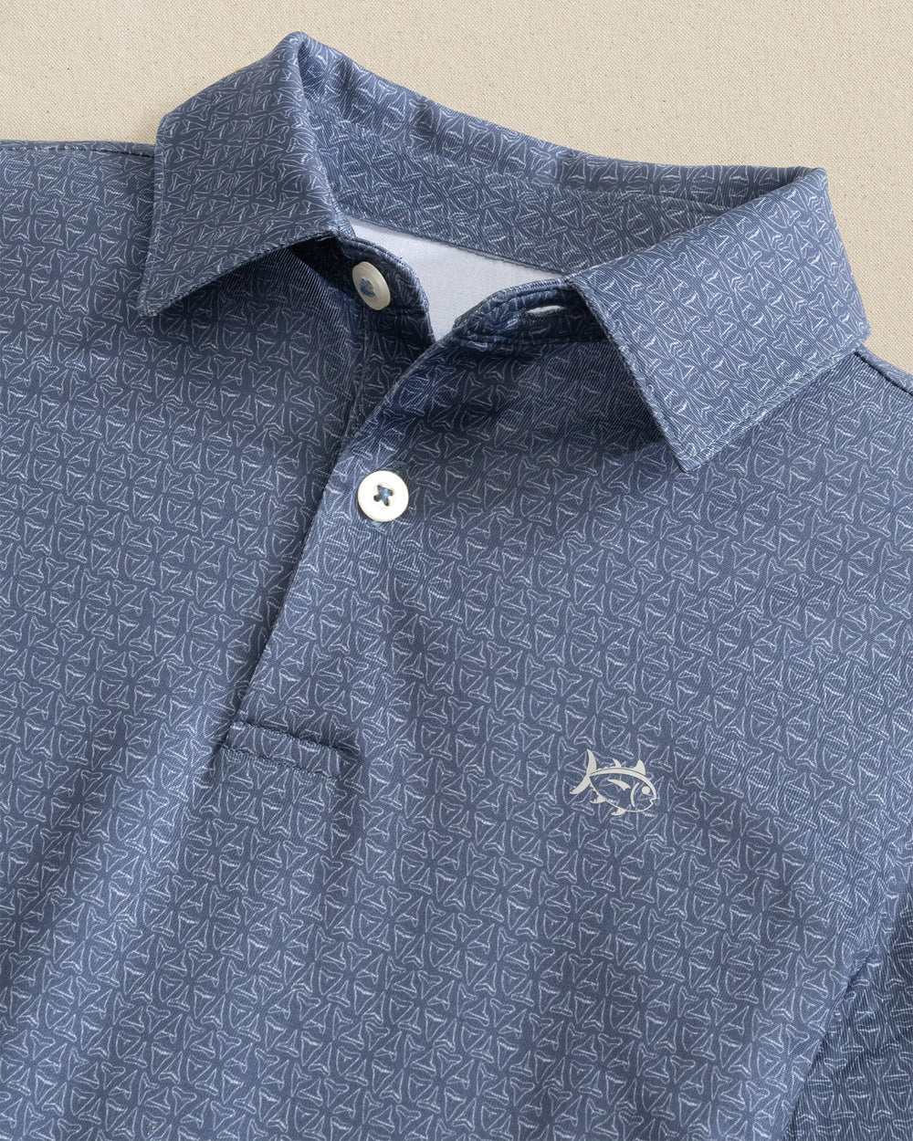 The detail view of the Southern Tide Boys Driver Jaw Breakers Performance Polo by Southern Tide - Light Indigo 