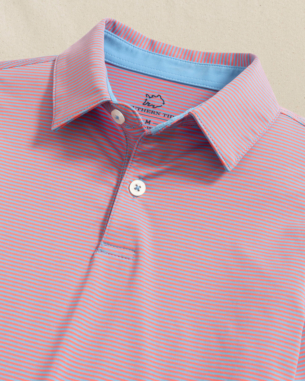 The detail view of the Southern Tide Boys Driver Meadowbrook Stripe Performance Polo by Southern Tide - Coral Beach