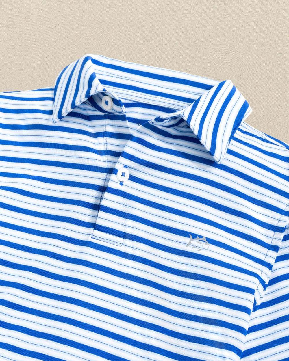 The detail view of the Southern Tide Boys Driver Ocean Hill Stripe Performance Polo by Southern Tide - Surf Blue