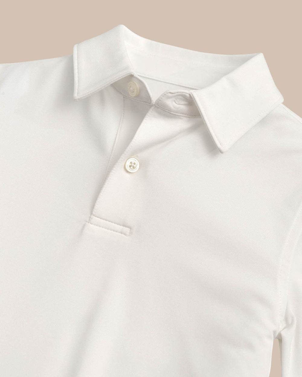 The detail view of the Boys Driver Performance Polo Shirt by Southern Tide - Classic White