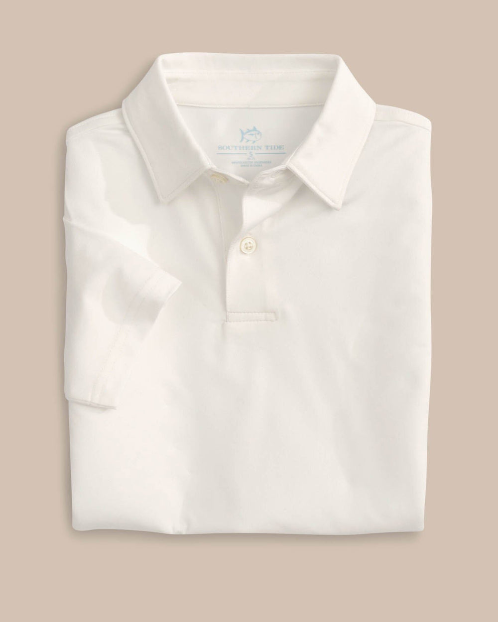The folded view of the Boys Driver Performance Polo Shirt by Southern Tide - Classic White