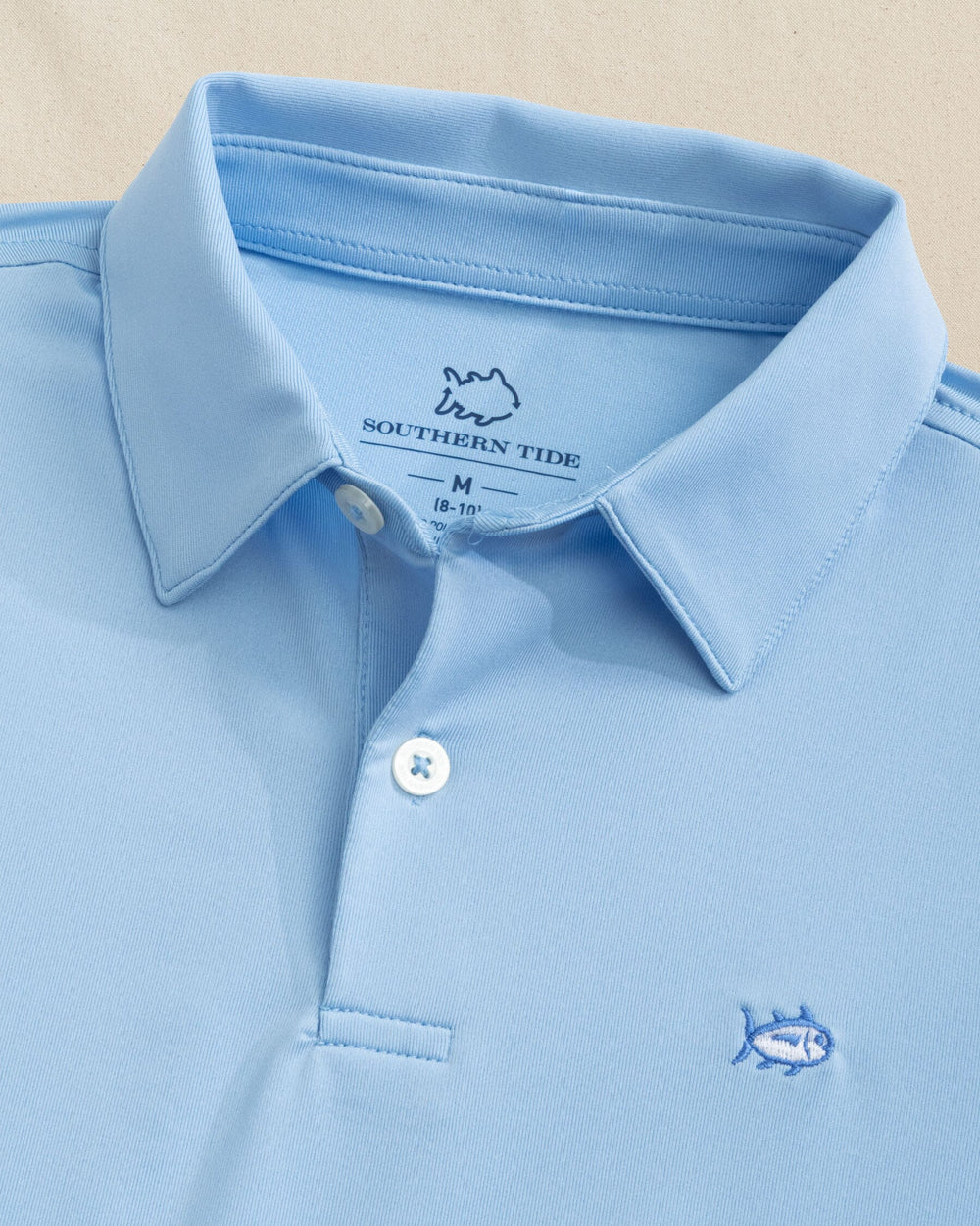 The detail view of the Southern Tide Boys Driver Performance Skipjack Polo by Southern Tide - Sky Blue
