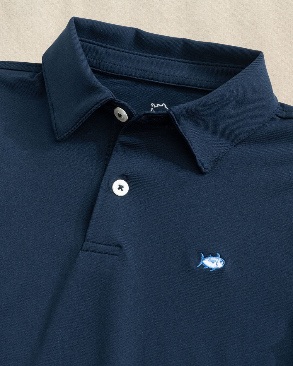 The detail view of the Southern Tide Boys Driver Performance Skipjack Polo by Southern Tide - True Navy
