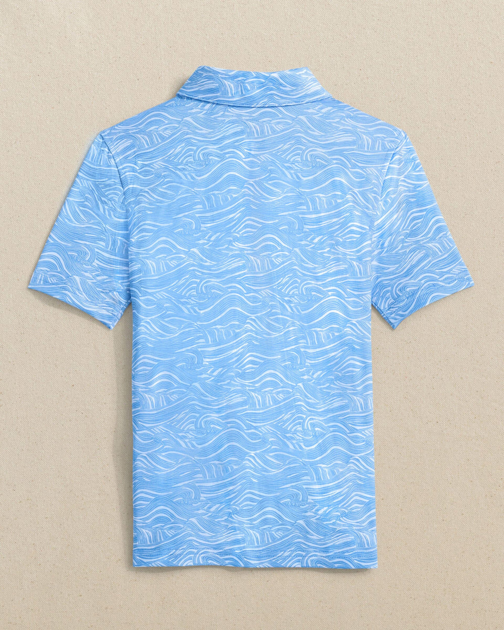 The back view of the Southern Tide Boys Driver Rolling Waves Printed Performance Polo by Southern Tide - Boat Blue