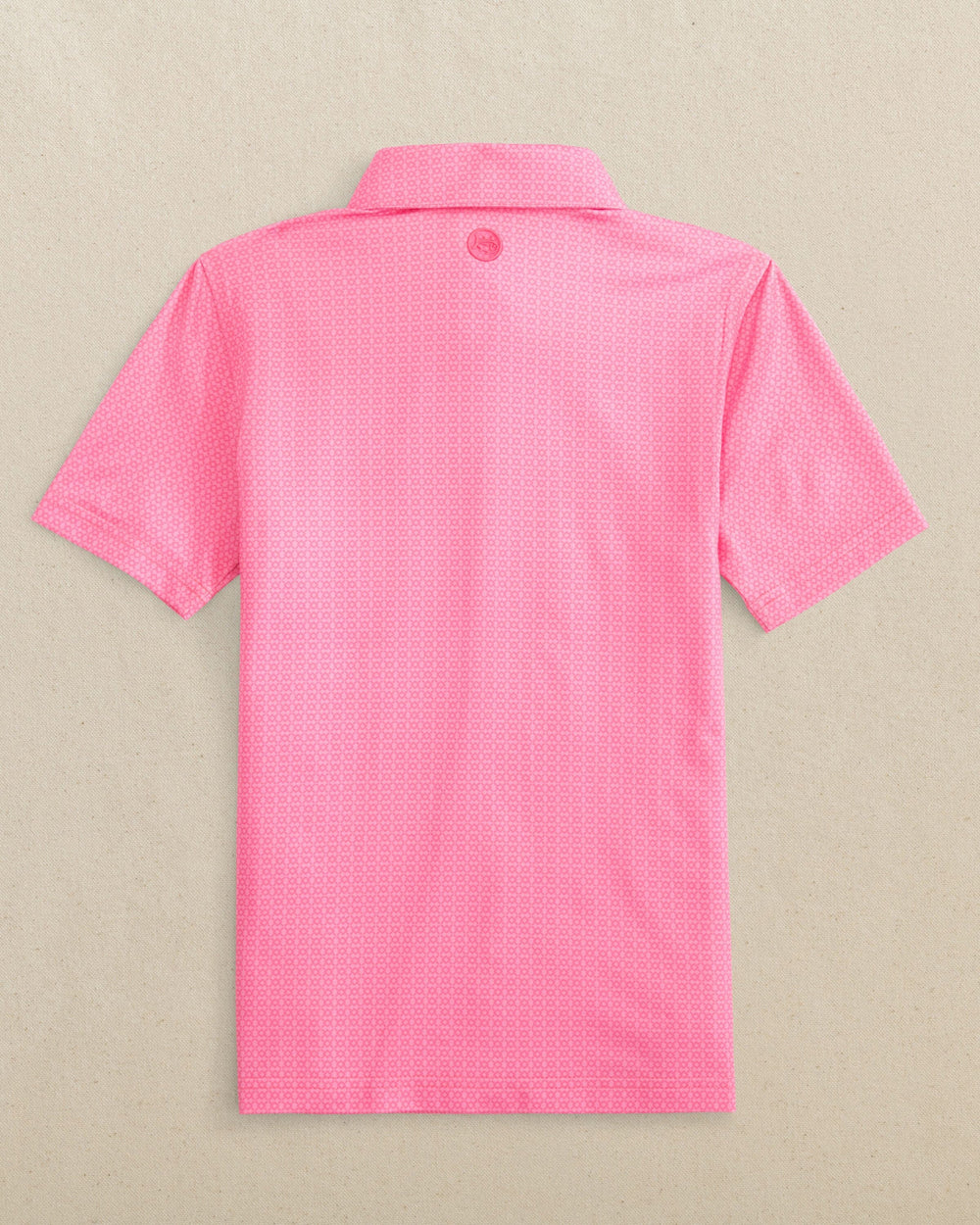 The back view of the Southern Tide Boys Driver Seaside Geo Printed Performance Polo by Southern Tide - Sea Pink