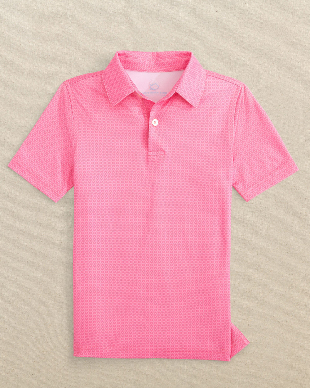 The front view of the Southern Tide Boys Driver Seaside Geo Printed Performance Polo by Southern Tide - Sea Pink