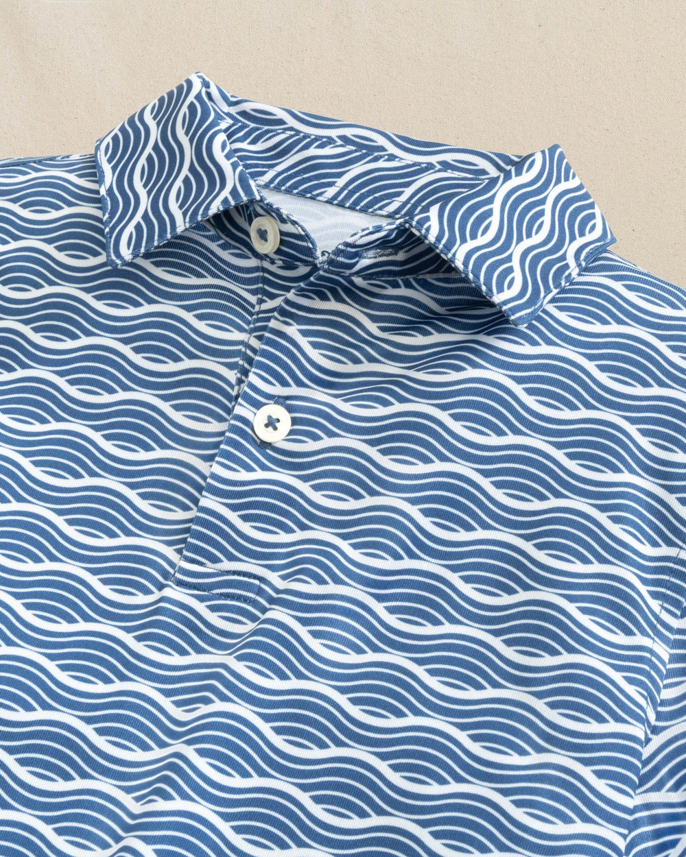 The detail view of the Southern Tide Boys Driver Waves Printed Performance Polo by Southern Tide - Nautical Blue