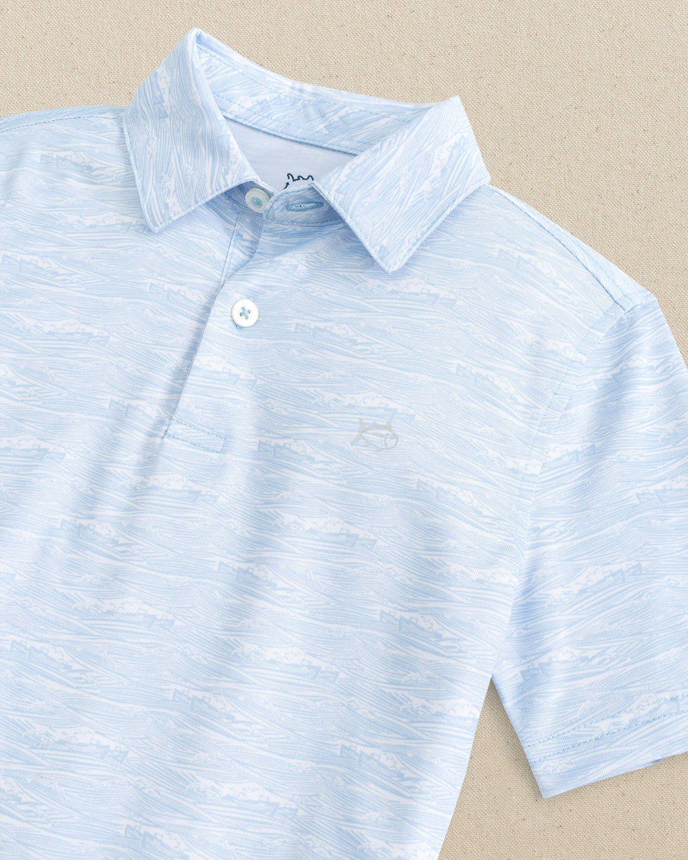 The detail view of the Southern Tide Boys Get In Shipshape Printed Performance Polo by Southern Tide - Classic White