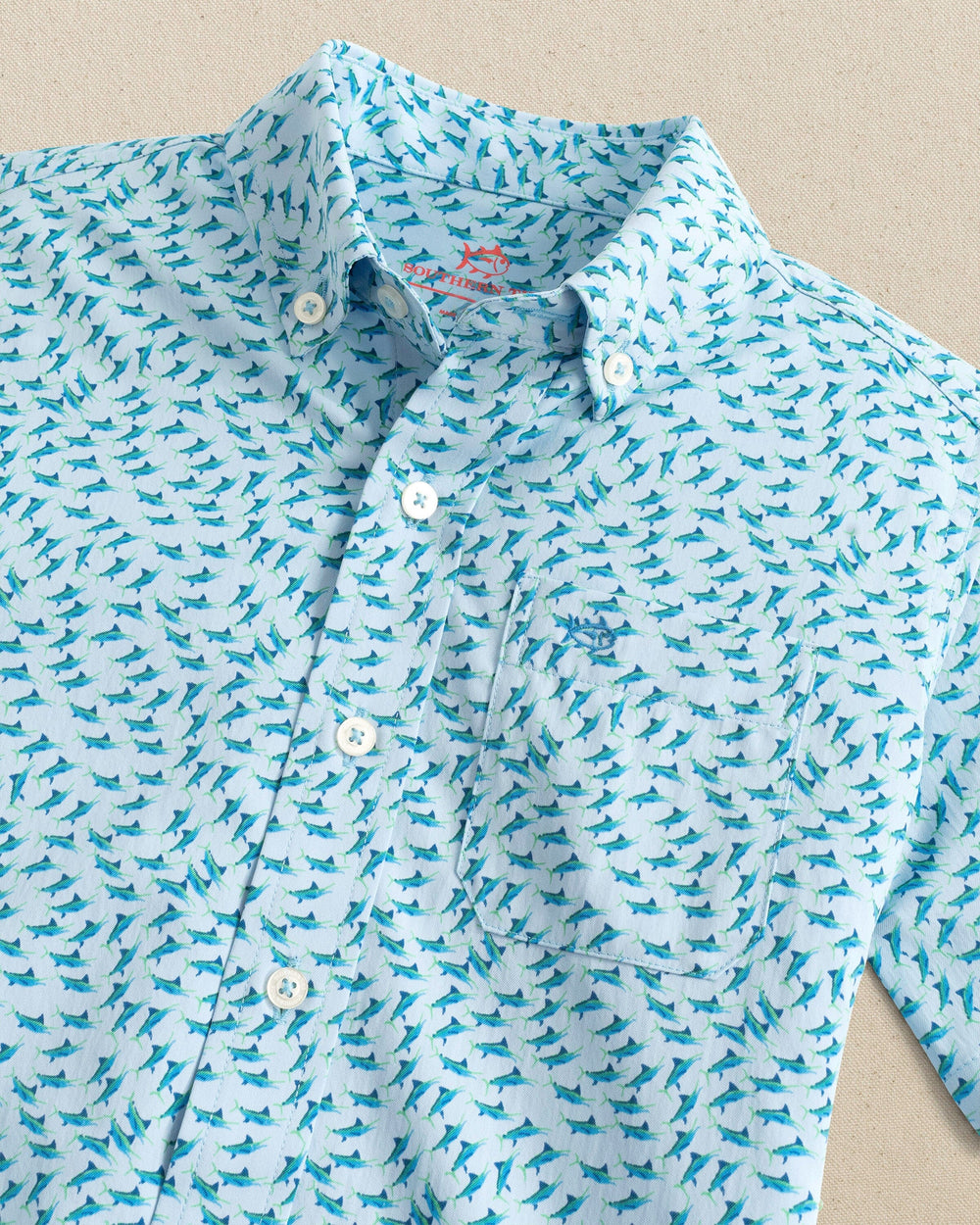 The detail view of the Southern Tide Boys Intercoastal Fintastic Short Sleeve Sport Shirt by Southern Tide - Cerulean