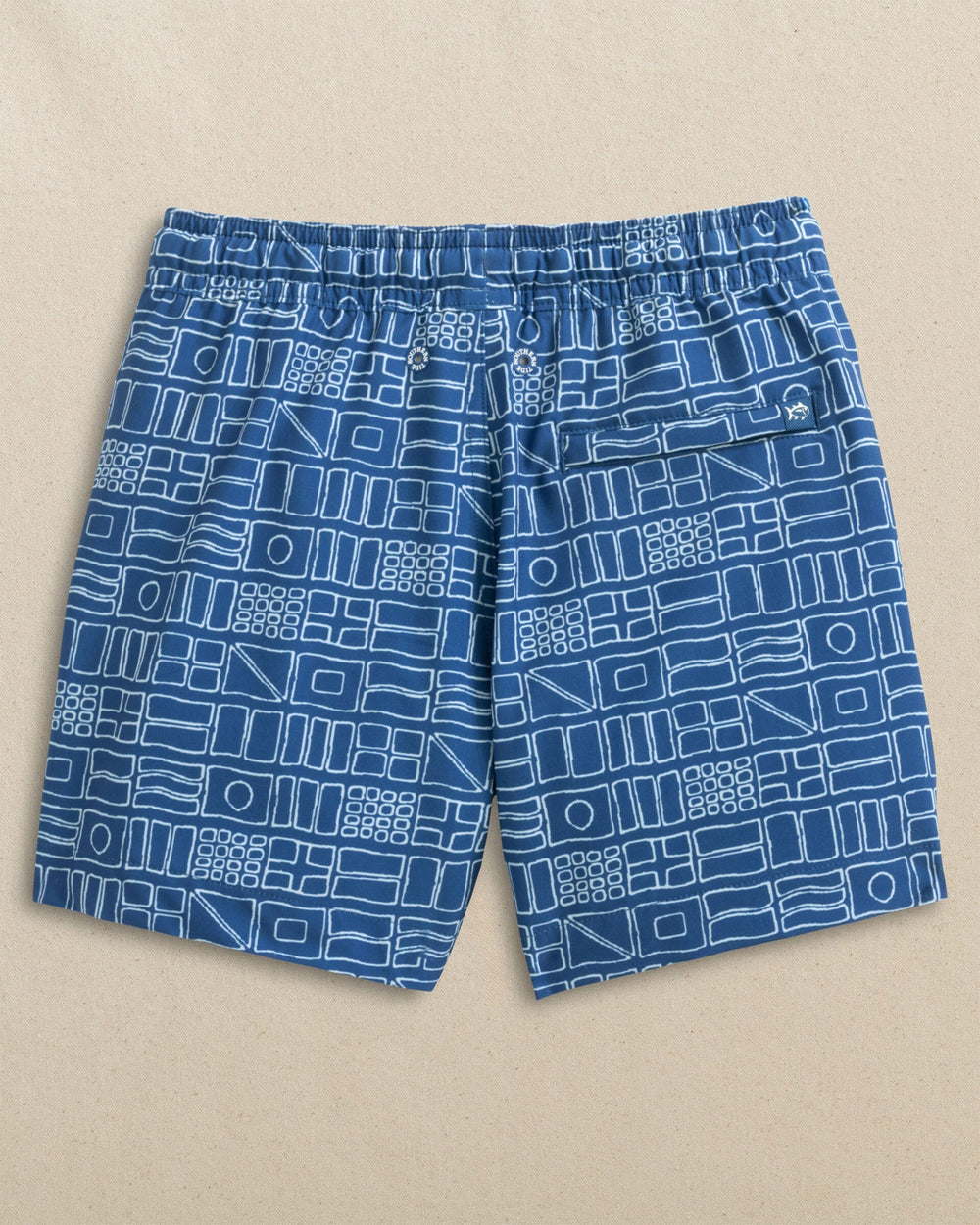 The back view of the Southern Tide Boys Nautical Flags Swim Trunk by Southern Tide - Nautical Blue